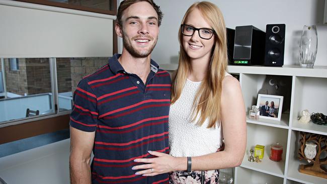 Jonathon Hedges and his fiance Lisa Spalding at their rented apartment in Gladesville, Sydney. The couple are saving to buy a house on the northern beaches. Picture: Adam Yip