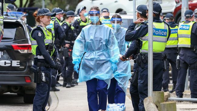 Medical staff about to enter public housing flats in Flemington, Melbourne in July. Picture: Getty Images