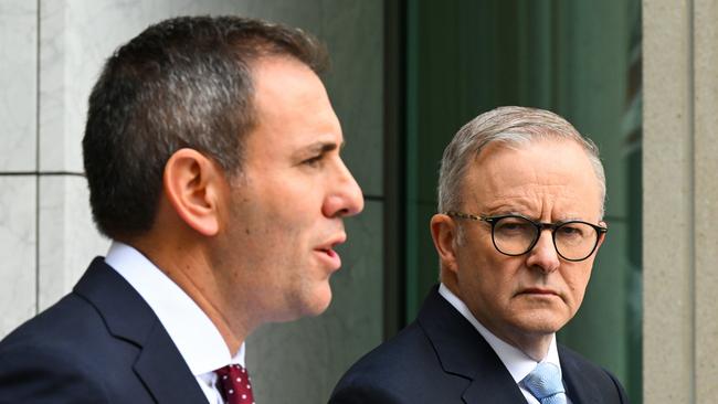 Anthony Albanese listens to Treasurer Jim Chalmers speak to the media during a press conference at Parliament House in Canberra.