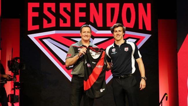 Josh Worsfold welcomes Andrew McGrath to Essendon. Picture: Toby Zerna