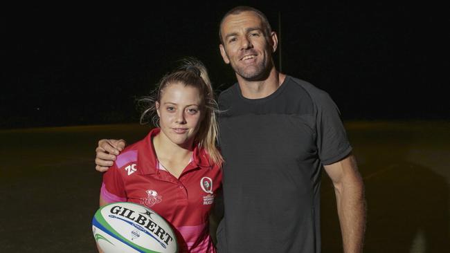 Fullback Samantha Treherne with Reds great Chris Latham at training.