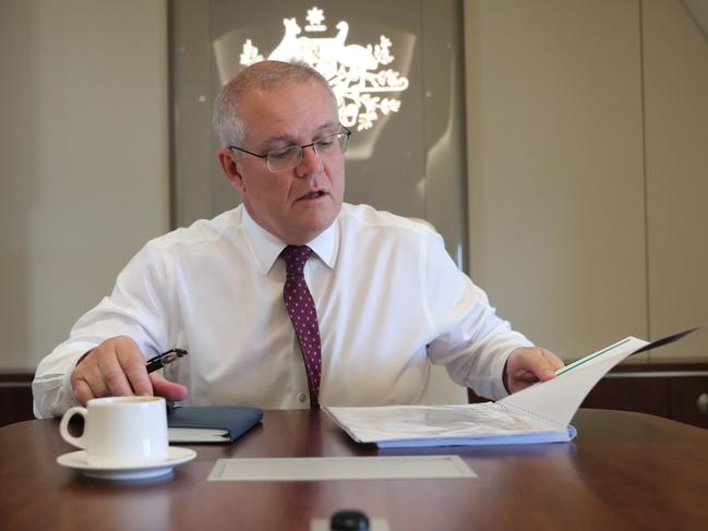 Australian Prime Minister Scott Morrison prepares his speech on the plane ahead of the G7 Summit in Cornwall. Picture: Adam Taylor/PMO
