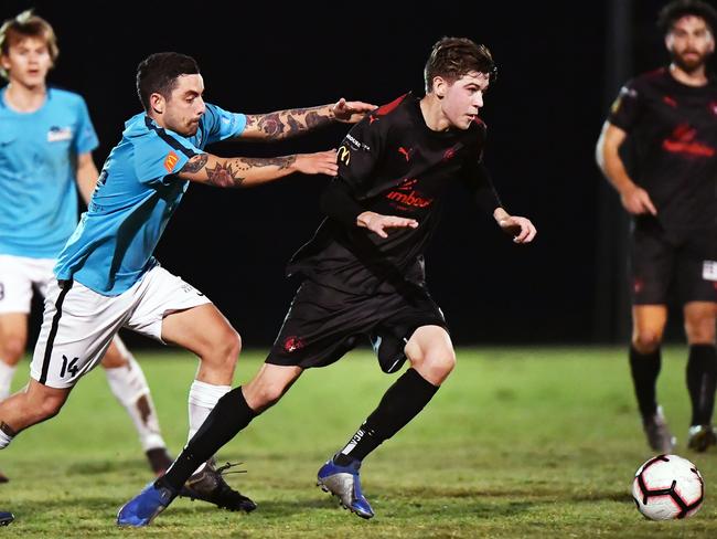 SOCCER: Maroochydore V Nambour Yandina United. Maroochydore's Jono Tyson tracks down Nambour's Jake Towie.