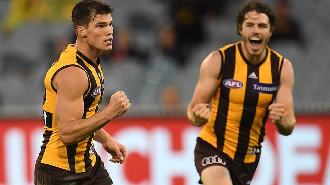 Jaeger O’Meara of the Hawks kicks a goal against Melbourne.