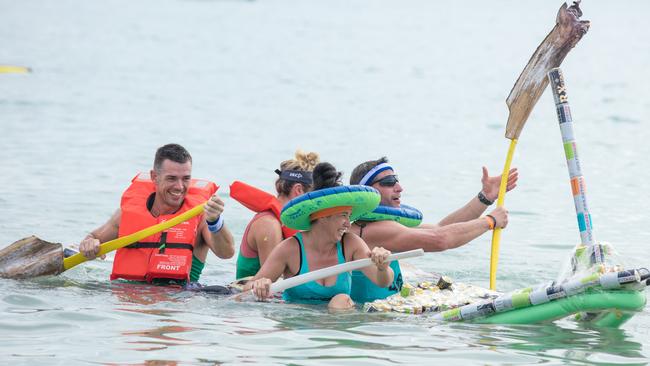 The CrossFit Darwin team gets that sinking feeling during the famous Darwin Lions Beer Can Regatta at Mindil Beach. Picture: Glenn Campbell