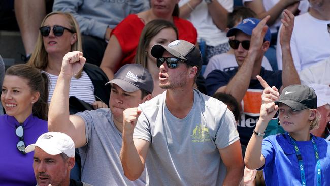 Lleyton (C) and Cruz Hewitt (R) cheer on Millman. Picture: AAP/Michael Dodge