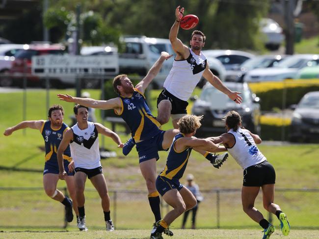 Southport v Canberra NEAFL clash at Southport Sharks. Ruckman Fraser Thurlow (Southport) and Cameron Milne (canberra) battle for supremacy. Picture Glenn Hampson