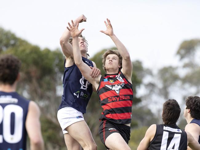 Lauderdale’s Harry Richmond and Launceston’s Jacob Boyd contest a mark. Picture: Chris Kidd