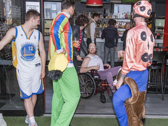 Players ordering the first round of many drinks for the day. Picture: Jason Edwards