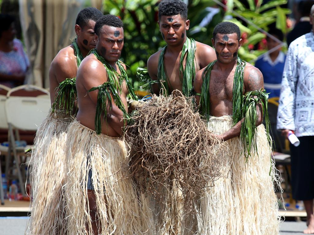 The Duke and Duchess of Sussex Prince Harry and Meghan take part in a traditional fijian ceremony at Nadi Airport in Fiji to . Picture: Nathan Edwards