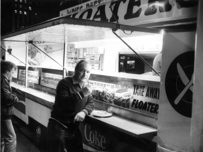 Charles Oram eats at the pie cart on North Terrace outside the Adelaide Railway Station, 1985.