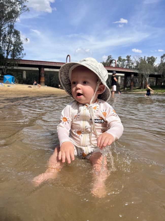 Cooling off in the Murray at Moama Beach on a 34C day. Picture: Tiffany Newton, Echuca.