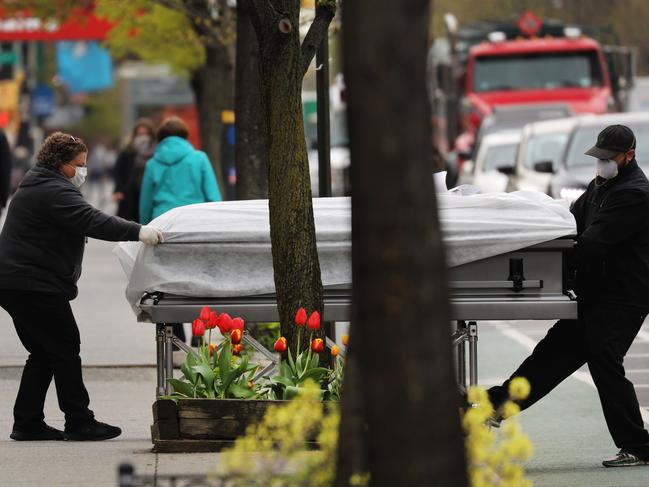 A casket is delivered to a funeral home. Picture: AFP