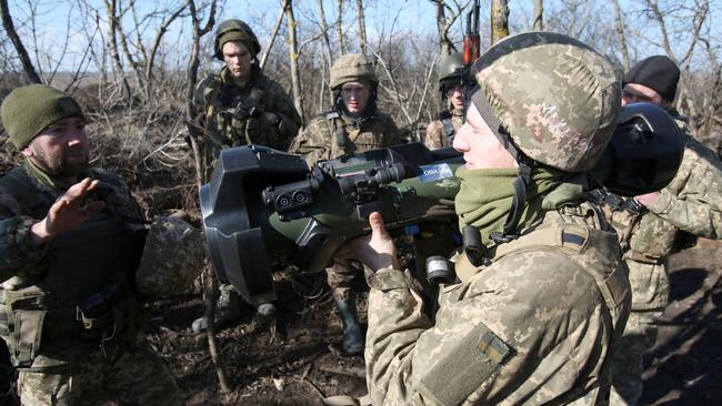 Servicemen of Ukrainian Military Forces on the front-line with Russia-backed separatists. Picture: Anatolii Stepanov/ AFP.