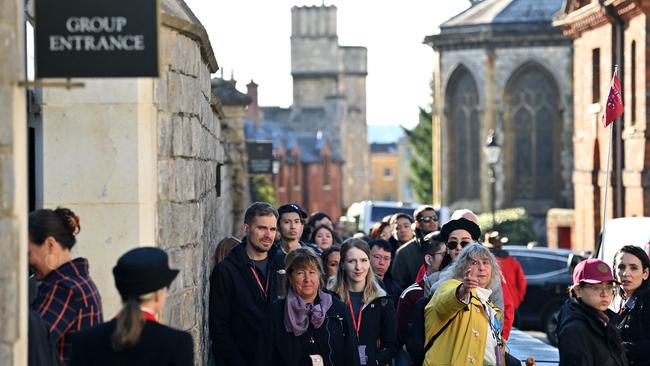 Members of the public and tourists queue to visit Windsor Castle in Windsor, to visit the Queen’s final resting place. Picture: AFP