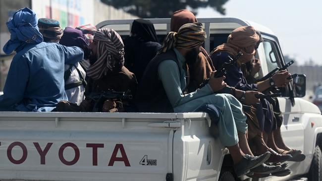 Taliban fighters patrol on a vehicle outside Kabul International Airport in Kabul. Picture: AFP