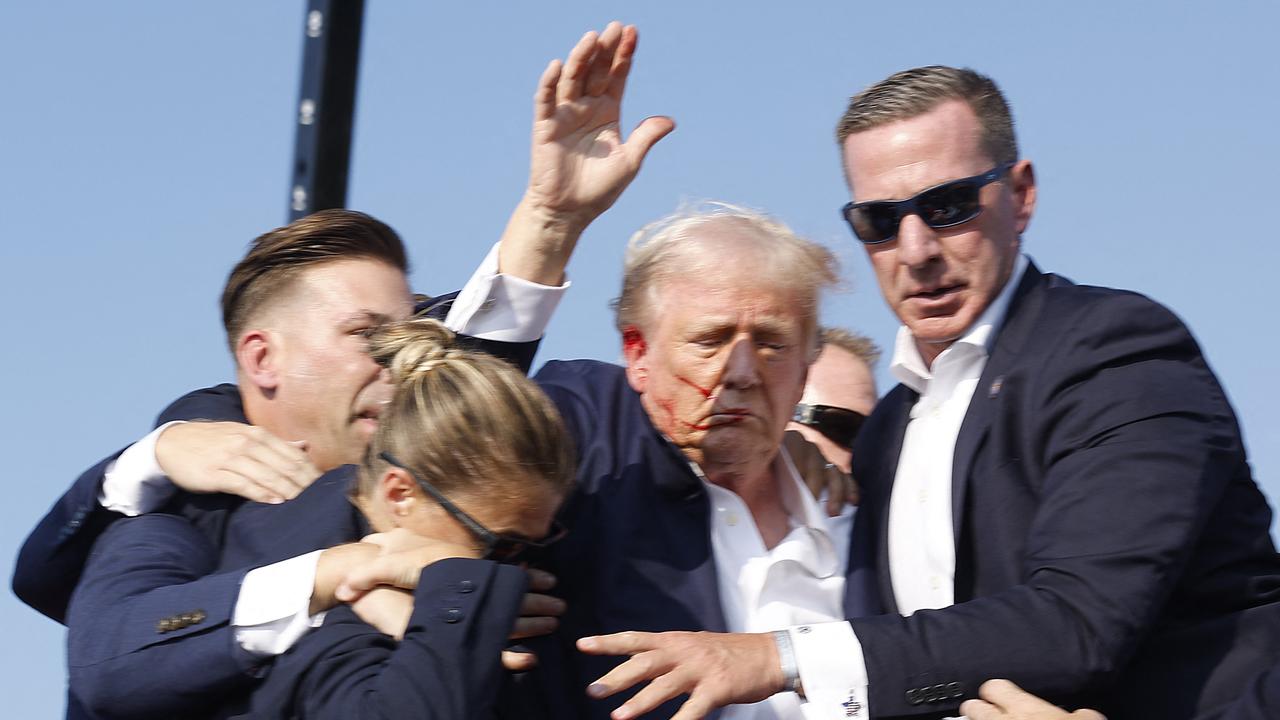 Republican presidential candidate former President Donald Trump is rushed offstage during a rally on July 13, 2024 in Butler, Pennsylvania. Picture: Anna Moneymaker/Getty Images/AFP