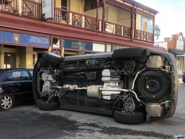 A Car has hit a parked car and then rolled on Kensington Road , Norwood . Picture: Emma Brasier