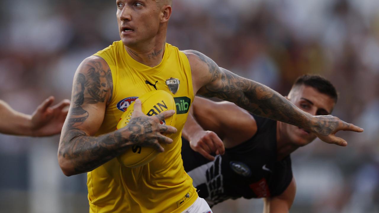 MELBOURNE , AUSTRALIA. February 27, 2024. AFL . Collingwood vs Richmond at Ikon Park, Carlton. Richmonds Dustin Martin fends off Nick Daicos of the Magpies during the 2nd qtr. . Pic: Michael Klein