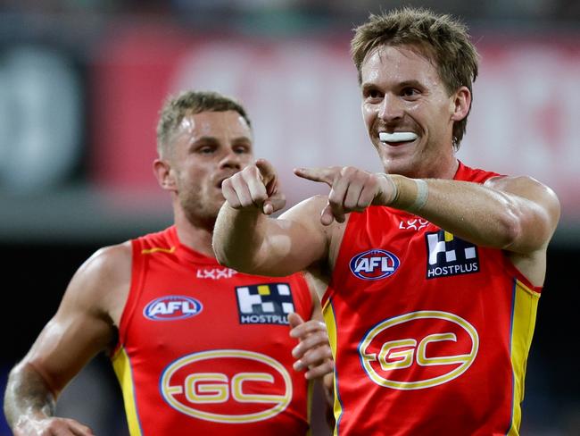 GOLD COAST, AUSTRALIA - MARCH 09: Noah Anderson of the Suns celebrates a goal during the 2024 AFL Round 01 match between the Gold Coast SUNS and the Adelaide Crows at People First Stadium on March 16, 2024 in Gold Coast, Australia. (Photo by Russell Freeman/AFL Photos via Getty Images)