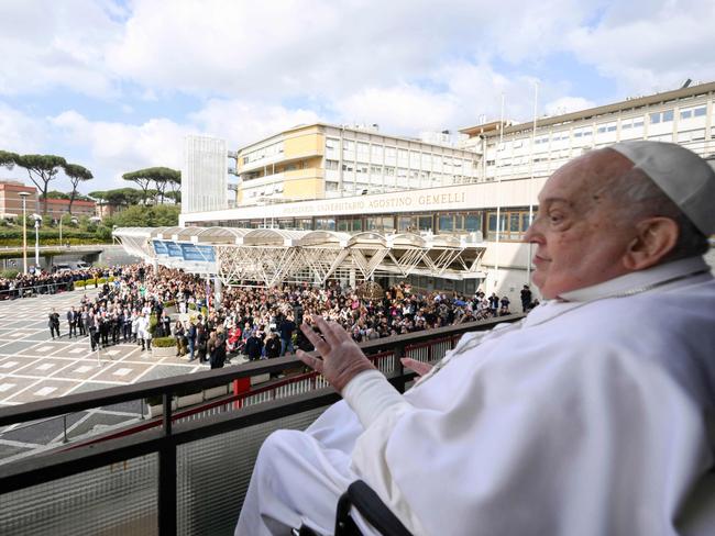 Pope Francis waving to the crowd from a window of the Gemelli hospital in Rome before being discharged following a five weeks hospitalisation for pneumonia. Picture: AFP