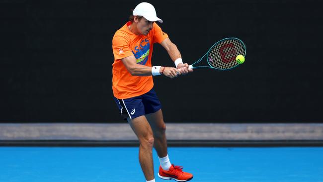 Alex de Minaur plays a backhand during a training session ahead of the 2024 Australian Open. Picture: Getty Images