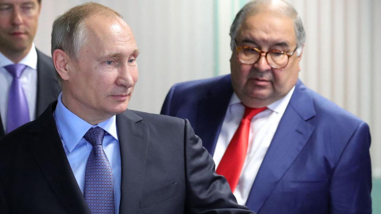 Russian President Vladimir Putin and oligarch Alisher Usmanov. Picture: Mikhail KLIMENTYEV / Sputnik / AFP.