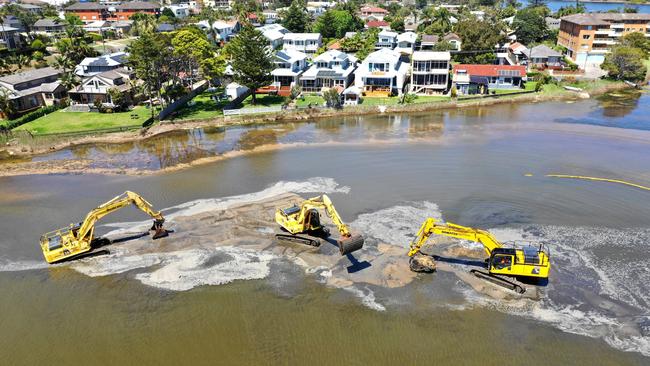 Sand being removed from Narrabeen Lagoon west of the Ocean St bridge in 2018. Photo Manly Daily