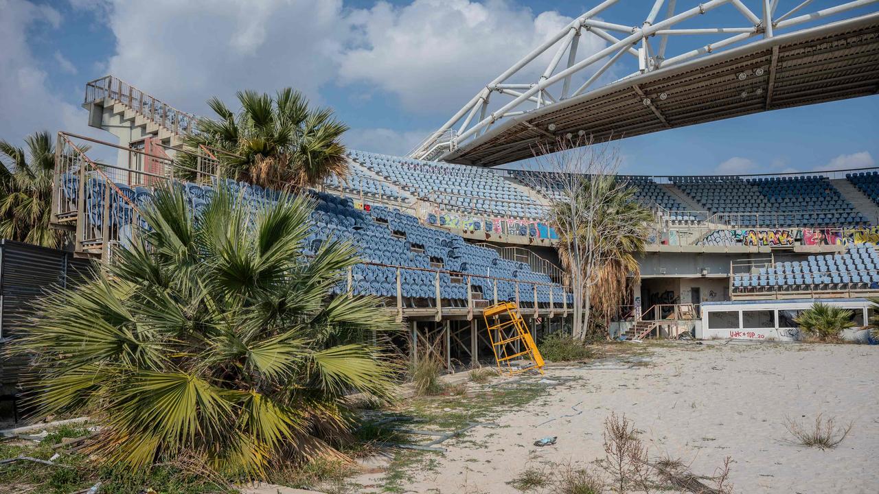 This photograph taken on February 19, 2024 shows the abandoned beach volleyball stadium at the Faliro Olympic coastal zone in Athens. (Photo by Angelos TZORTZINIS / AFP)