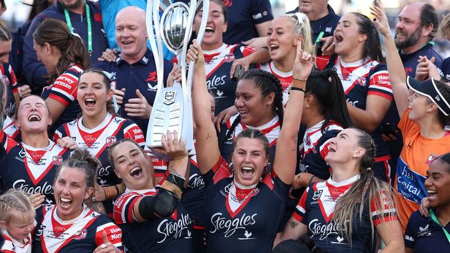 SYDNEY, AUSTRALIA - OCTOBER 06:  Isabelle Kelly and Jessica Sergis of Roosters pose with the NRL Women's Premiership Trophy after winning the NRLW Grand Final match between Sydney Roosters and Cronulla Sharks at Accor Stadium on October 06, 2024, in Sydney, Australia. (Photo by Cameron Spencer/Getty Images)