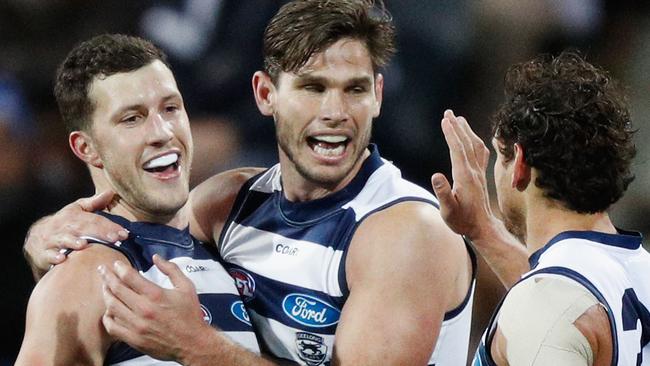 Sam Menegola, Tom Hawkins and Steven Motlop celebrate a goal for Geelong. Picture: Getty Images