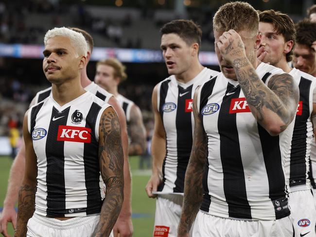 MELBOURNE, AUSTRALIA - MARCH 21: Dejected Magpies players walk from the ground after the round two AFL match between St Kilda Saints and Collingwood Magpies at Melbourne Cricket Ground, on March 21, 2024, in Melbourne, Australia. (Photo by Darrian Traynor/Getty Images)