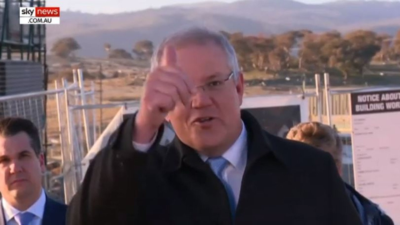 Scott Morrison gives the thumbs up to the man whose grass was trampled on. Picture: Sky News