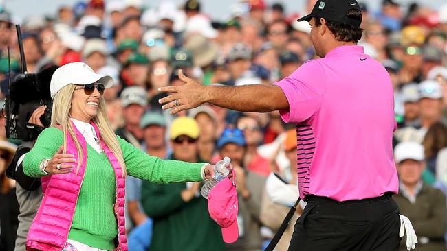 Reed celebrates with his wife Justine after making par 18th green to win the 2018 Masters Tournament. Picture: Getty Images.