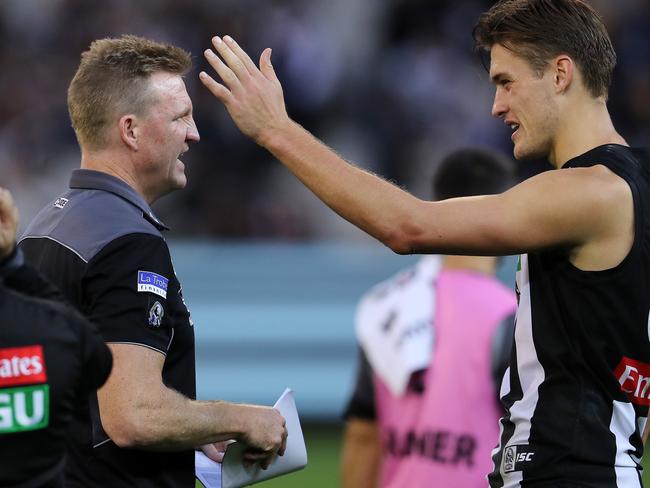 AFL Round 6. Geelong vs. Collingwood at the MCG. Collingwood coach Nathan Buckley talks with Darcy Moore at 3 qtr time  . Pic: Michael Klein