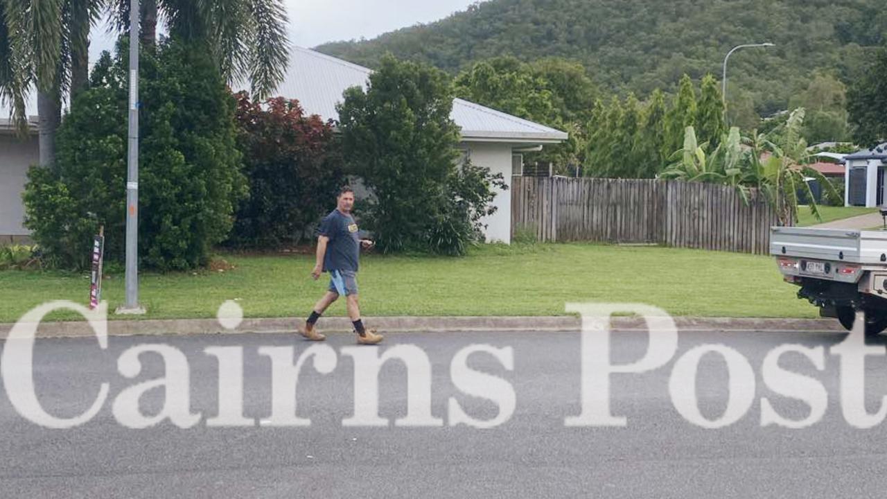 Cairns business identity Greg Nucifora is seen placing a corflute near mayor Bob Manning's home in Gordonvale.