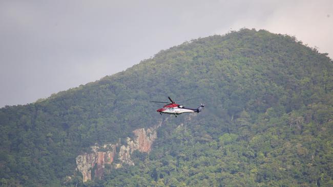 The Rescue 510 rescue helicopter assisting police on the Captain Cook Highway. Picture: PETER CARRUTHERS