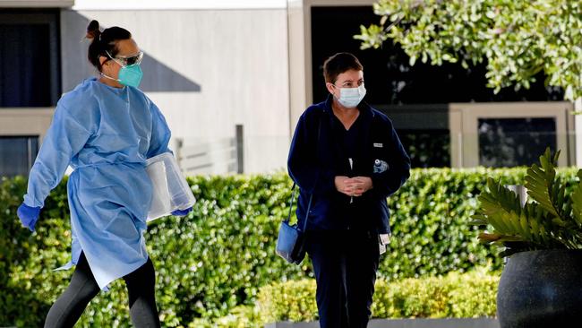 Staff members are seen arriving at the SummitCare nursing home in Baulkham Hills. Picture: NCA NewsWire/Bianca De Marchi