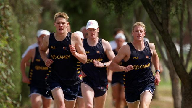 SA footballer Laurence Angwin, left, with Brett Burton during Adelaide Crows pre-season training in 2001.