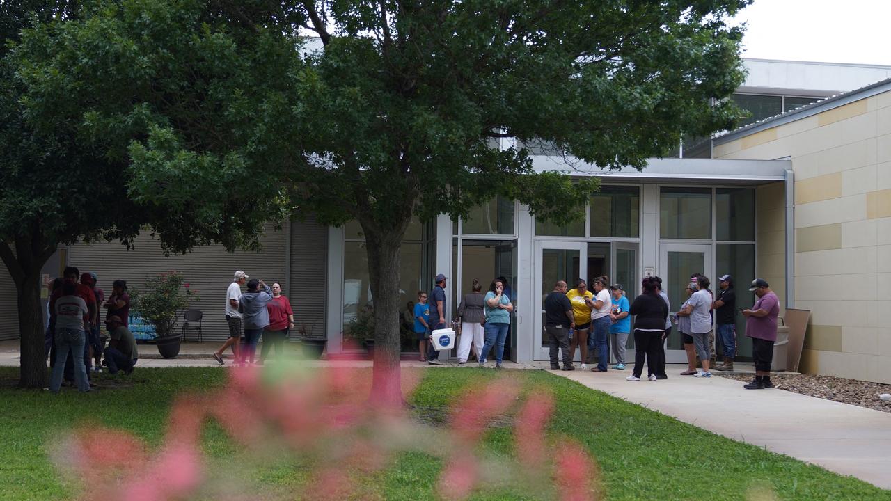 Friends and families gather in mourning outside the Willie de Leon Civic Centre where grief counselling will be offered in Uvalde. Picture: Allison Dinner/AFP