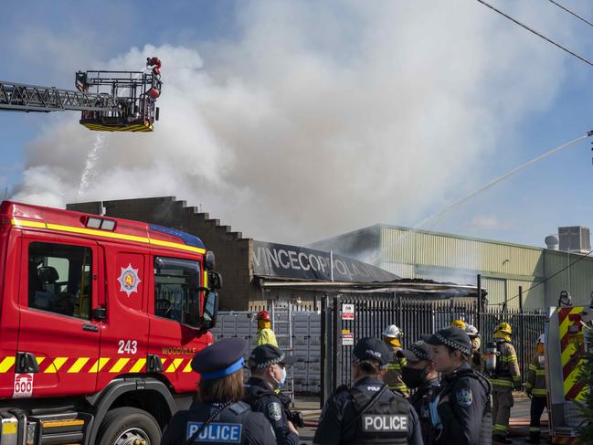 Police and MFS on the scene of the warehouse fire in Brompton. Picture: Naomi Jellicoe