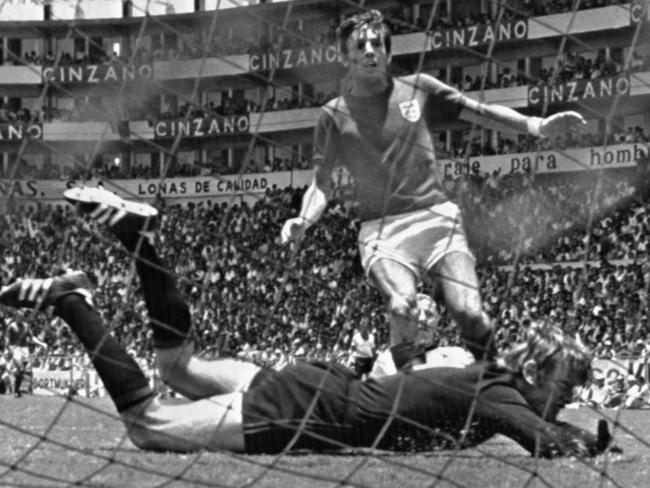 FILE - In this June 14, 1970 file photo, England's Martin Peters scores his country's second goal in the world cup quarter final against West Germany at Leon, Mexico. Peters, who scored one of England's goals in its victory over West Germany in the 1966 World Cup final, has died after a long battle with Alzheimer's disease. He was 76. Peters' family announced his death on Saturday, Dec. 21, 2019 via a statement through English soccer club West Ham, saying he passed away peacefully in his sleep. (AP Photo, File)