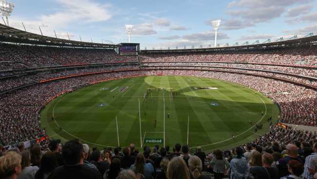 AFL fans flock to Melbourne Cricket Ground to commemorate Anzac Day at ...