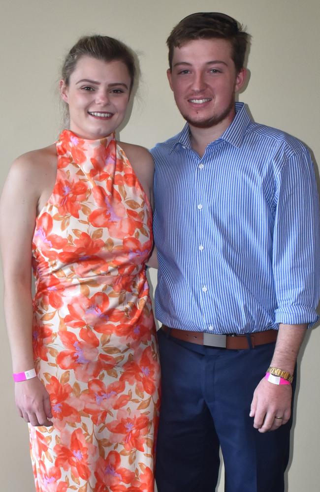 Kylah and Nick McHale at the Rockhampton Jockey Club's Pink Ribbon Stradbroke Charity Race Day at Callaghan Park on June 15, 2024.