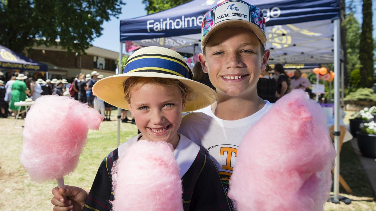 Jemima and Fred Hudson enjoy fairy floss at the Fairholme College Spring Fair. Picture: Kevin Farmer