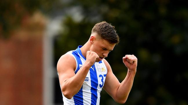 MELBOURNE, AUSTRALIA - MAY 7: Cooper Harvey of the Kangaroos celebrates kicking a goal during the round seven VFL match between the North Melbourne Kangaroos and the Sandringham Zebras at Arden Street Ground on May 7, 2023 in Melbourne, Australia. (Photo by Josh Chadwick/Getty Images)