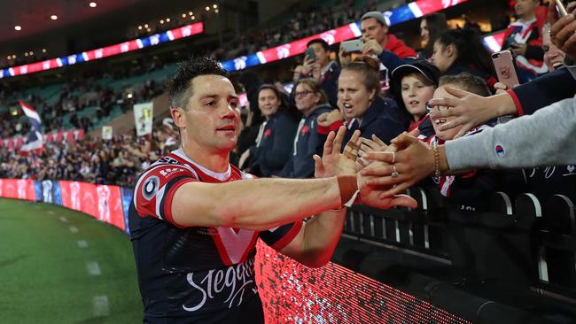 Cooper Cronk celebrates with Roosters fans after victory over South Sydney in the qualifying final at the SCG. Picture: Brett Costello