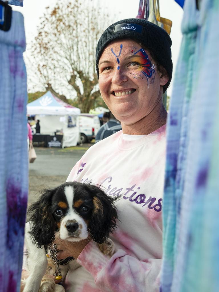 Pauline Drury, wife of organiser Billy Drury, holding Archie in her Bellafly Creations stall at the Something About Bella – Bella's Birthday Fundraiser for Toowoomba Hospital Foundation, Sunday, June 4, 2023. Picture: Kevin Farmer