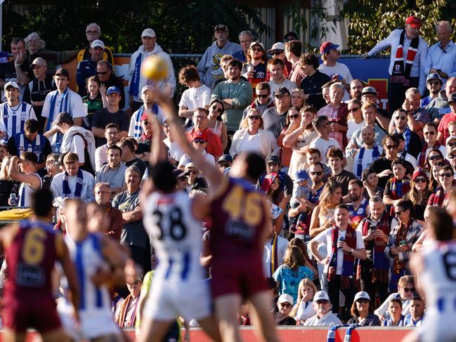 ADELAIDE, AUSTRALIA - APRIL 05: Fans watch on during the 2024 AFL Round 04 match between the Brisbane Lions and the North Melbourne Kangaroos at Norwood Oval on April 05, 2024 in Adelaide, Australia. (Photo by Dylan Burns/AFL Photos via Getty Images)