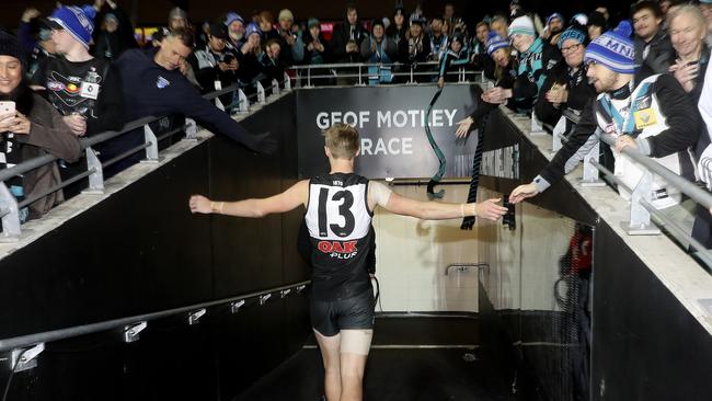 After an emotional first game back after the death of his father Todd Marshall walks down the race to gather himself before walking off with his team. Picture: Sarah Reed